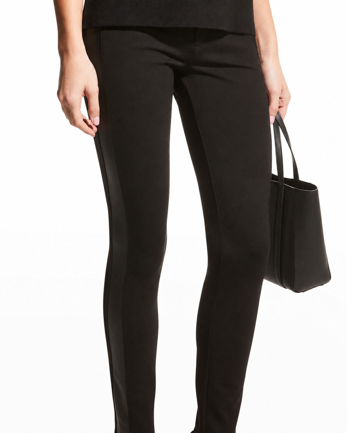AI-enhanced detail crop of PAIGE Karlee black ponte pants and side panel